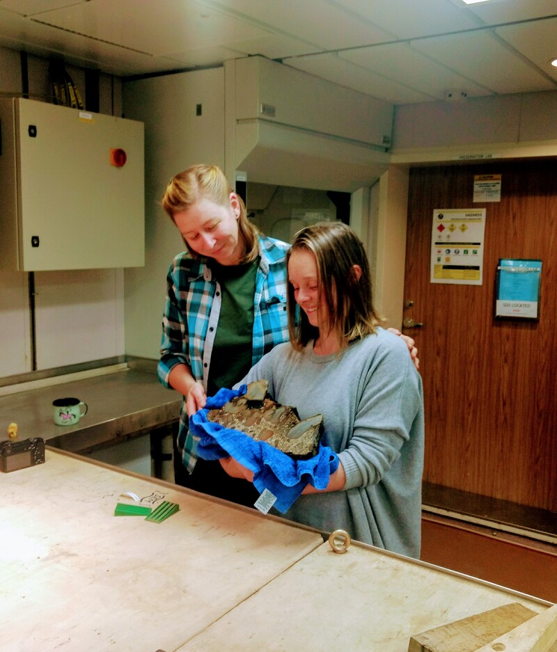 Jo Whittaker (Chief scientist) and Chantelle Ridley (scientific researcher) share a moment with their rock baby, Charlton.